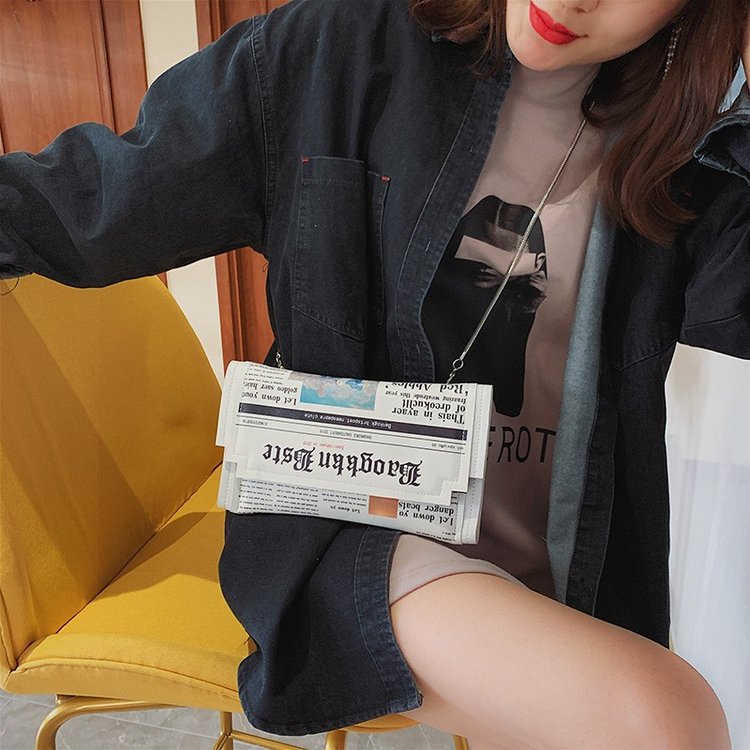 Newspapers modeling day clutch - Flap Bag Envelope review and price